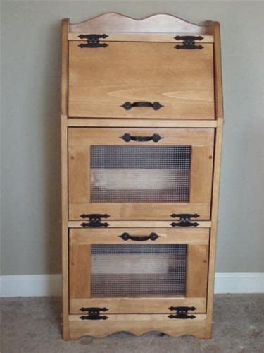Cool, dark and dry, with air circulation. This handcrafted vegetable/bread bin features an area on ...