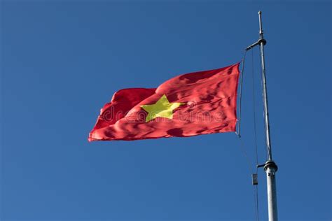 Vietnam Flag On Top Pole Against Beautiful Clear Blue Sky Stock Image