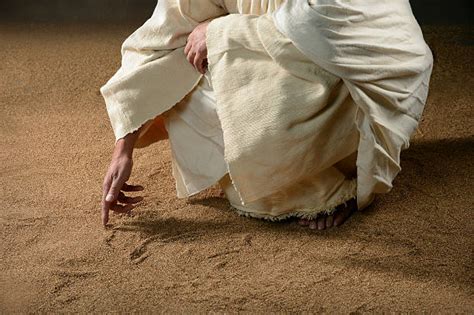 Jesus Writing In The Sand Stock Photos Pictures And Royalty Free Images