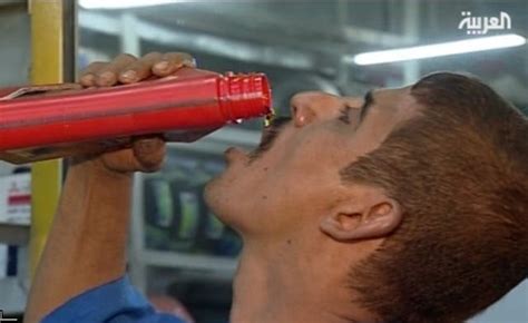 Man Enjoys Drinking Car Oil