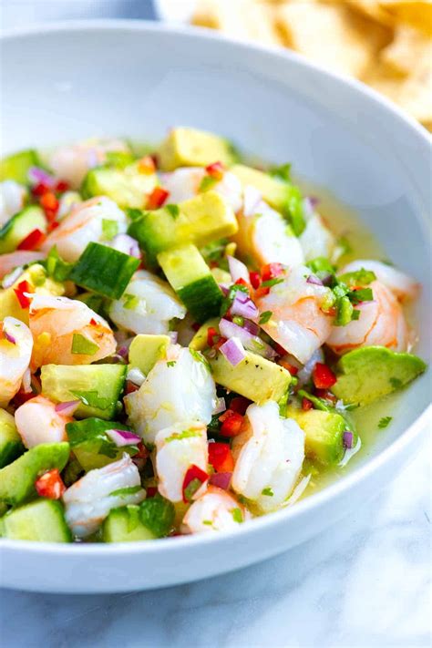 Place shrimp in a glass bowl and cover with lime juice to marinate (or 'cook') for about 10 minutes, or until they turn pink and opaque. Fresh and Easy Shrimp Ceviche
