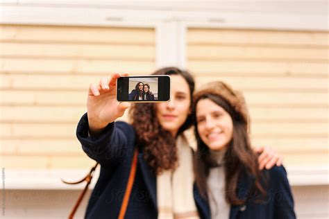 Two Women Taking Selfie By Stocksy Contributor Marija Kovac Stocksy