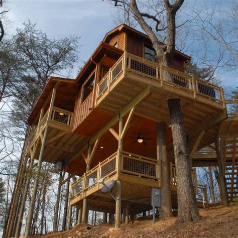 The Charms Of Treehouse Cabins Treehouse Cabins Tree House Plans
