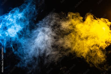 Abstract Blue And Yellow Smoke Background With Space For Text Foto De