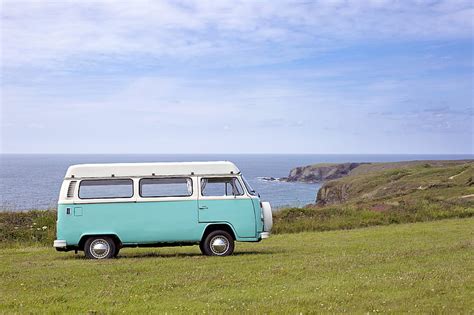 Royalty Free Photo Teal And White Volkswagen Van Parked On Green Grass