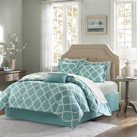 If you're going for a complete overhaul, add matching sheets. Teal Blue Fretwork Comforter Set - Queen Size