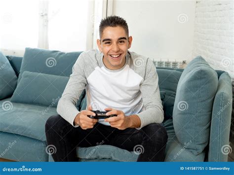 Close Up Portrait Of Young Man Playing Video Game Having Fun In Video