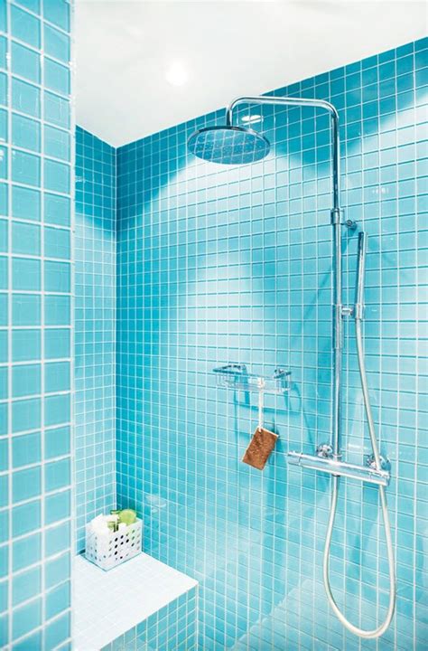 The watery blue and green mosaic tile border enlivens this classic subway tile look. 41 aqua blue bathroom tile ideas and pictures