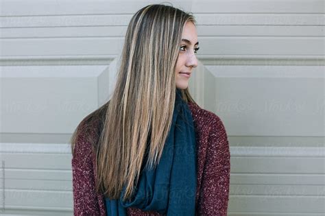 Profile Of A Beautiful Teenage Girl With Long Blonde Hair By Stocksy
