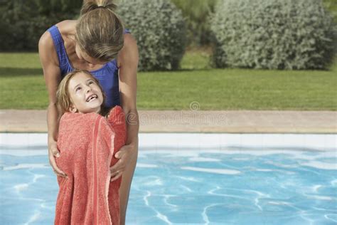 Mother Embracing Daughter Wrapped In Towel Stock Image Image Of