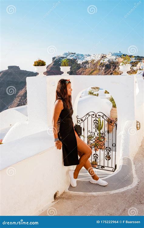 Woman On Vacation Greece Visisting Oia Santorini Girl On Holiday In Greece On A Luxury Trip To