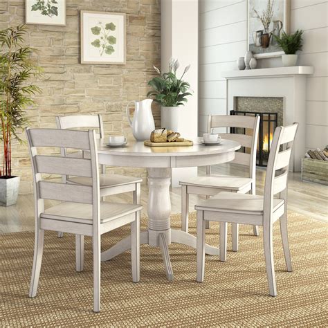 Find round kitchen tables in an array of styles, finishes and materials. Lexington 5-Piece Dining Set with Round Table and 4 Ladder ...
