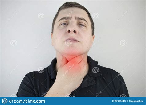 Man Touches A Sore Throat And Neck Twists From Irritation And