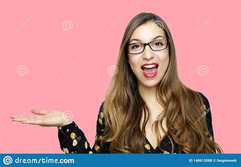 Surprised Funny Model Girl Wearing Glasses And Showing On Open Hand