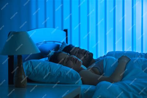 Premium Photo The Man And Woman Sleeping In The Comfortable Bed Night Time Full Grip Focus