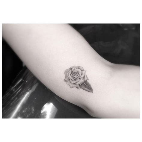 Small Fine Line Style Rose Tattoo On The Right Forearm