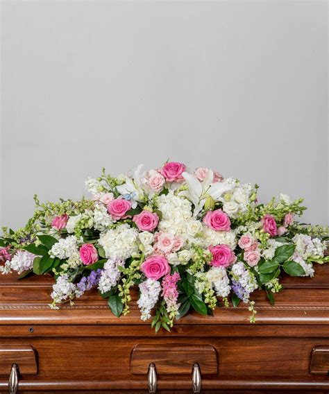Funeral flowers help celebrate the life of a friend or loved one. Pastel Casket Spray (With images) | Casket sprays, Funeral ...