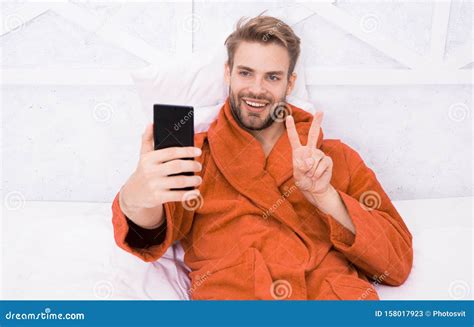Selfie Star Happy Man Taking Selfie With Smartphone In Bed Stock Image