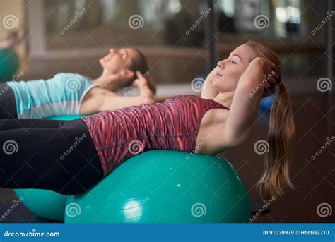 Two Young Women Exercising With Pilates Balls Stock Image Image Of Women Concept 91030979