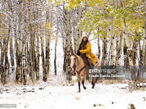 Cowgirls Riding Horses In Snow Rocky Mountains Wyoming Usa Photos And