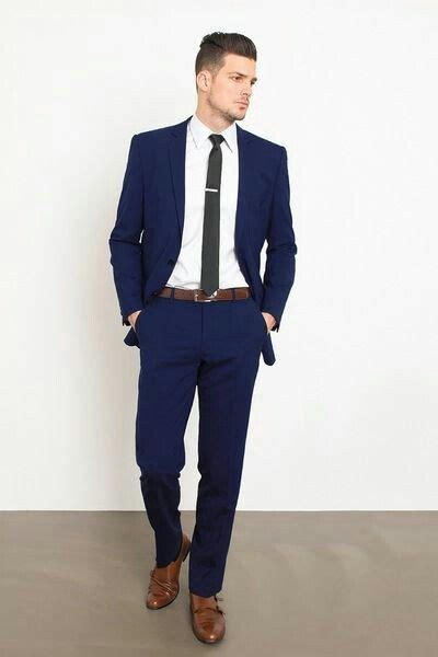 Every man should own a great suit. A navy suit is always a good idea, especially when paired ...