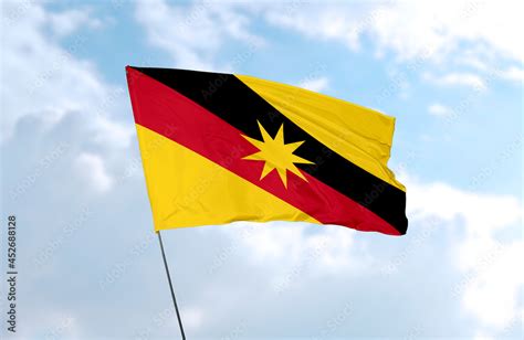 Flag Of Sarawak Realistic 3d Rendering In Front Of Blue Sky Stock