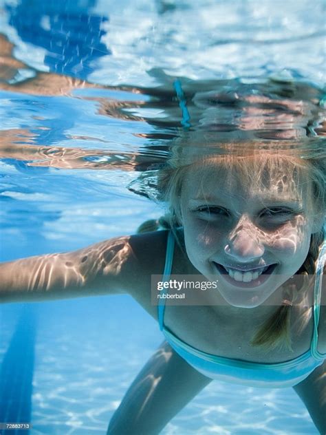 Girl Swimming Underwater In Pool High Res Stock Photo Getty Images