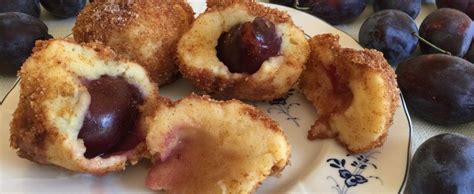 Dumpling is a broad class of dishes that consist of pieces of dough (made from a variety of starch sources) wrapped around a filling, or of dough with no filling. German Plum Potato Dumplings | Plum dumplings, Food ...