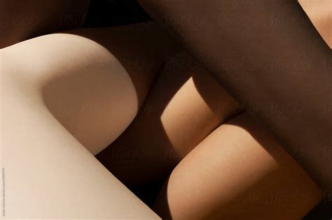 Mixed Skin Color Legs Crossed By Stocksy Contributor Sonja Lekovic