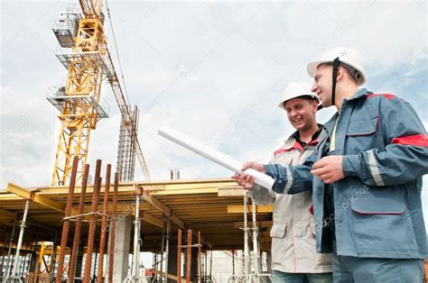 Engineers Builders At Construction Site — Stock Photo © Kalinovsky 5456925