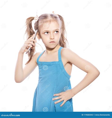 Young Seven Years Old Brunette Girl In Blue Dress On A White Iso Stock