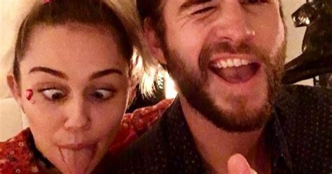 miley cyrus shares first snog with liam hemsworth for kissing day metro news