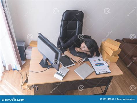 Tired Sleepy Female Office Worker Is Sleeping With A Lot Of Work On