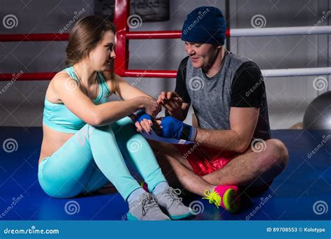 Male Sporty Boxer Helping To Prepare Bandages Athletic Female Stock