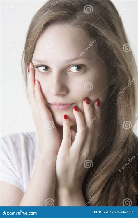 Naturaly Beautiful Woman Touching Her Face With Red Nails Hands Stock