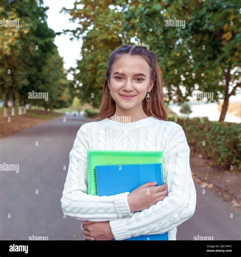 Cheerful And Joyful Teenager Girl 12 13 14 Years Old Summer Park Holds