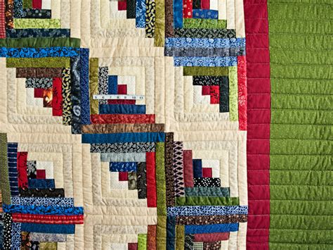 If this number is not a whole number but a decimal, round up or down to the nearest whole number depending on your preference. Multicolor Traditional Log Cabin Quilt | Hannah's Quilts