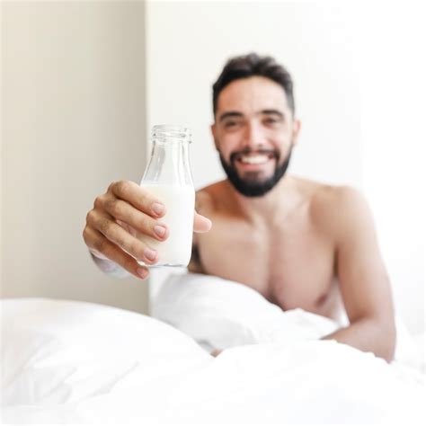 Free Photo Shirtless Young Man Holding Milk Bottle