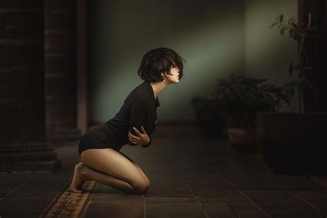 HD Wallpaper Woman Kneeling With Arms Folded Over Chest Inside Dim Lit