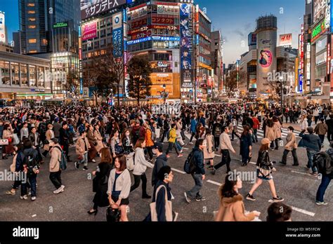 Shibuya Crossing Crowds Of People At Intersection Colorful Signs And