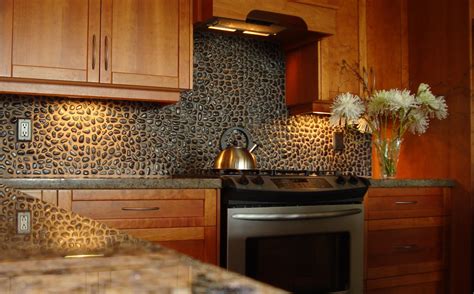 Black Stone Tile Backsplash Connected By Brown Granite Countertop