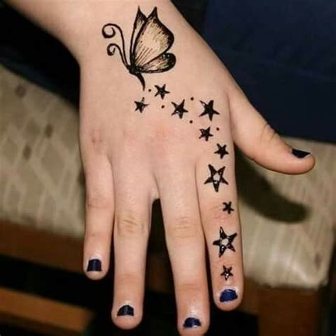 Every woman who visited india never returned back without applying mehndi on their hands. Butterfly and Stars Henna Designs | Henna tattoo hand ...