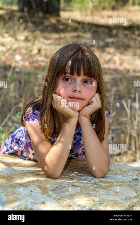 Dark Haired Pretty Pre Teen Caucasian Girl Posing For Camera Charlie