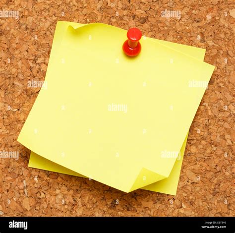 Two Blank Yellow Sticky Notes Pinned Onto Cork Board Stock Photo Alamy