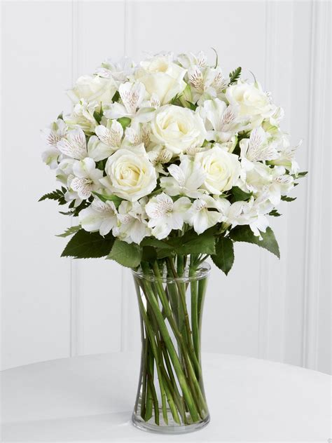 Maybe you would like to learn more about one of these? Vased white alstroemeria and standard roses. Alstroemeria ...