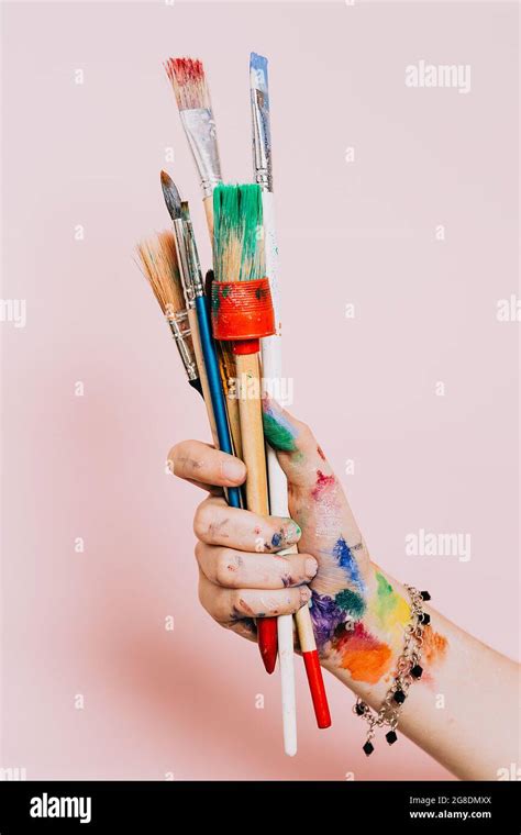 Creative Background Female Artist Hand Holding Colorful Paintbrushes