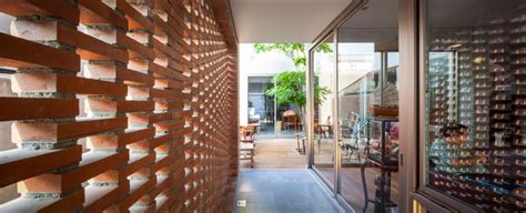 Perforated Brick Facades Make A Home More Stylish And Energy Efficient