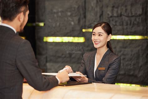 Hotel Front Desk Staff Check In For Customers Picture And Hd Photos