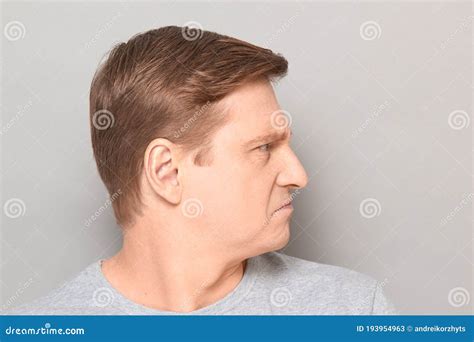 Portrait Of Angry Disgruntled Mature Man With Frowning Face Stock Image