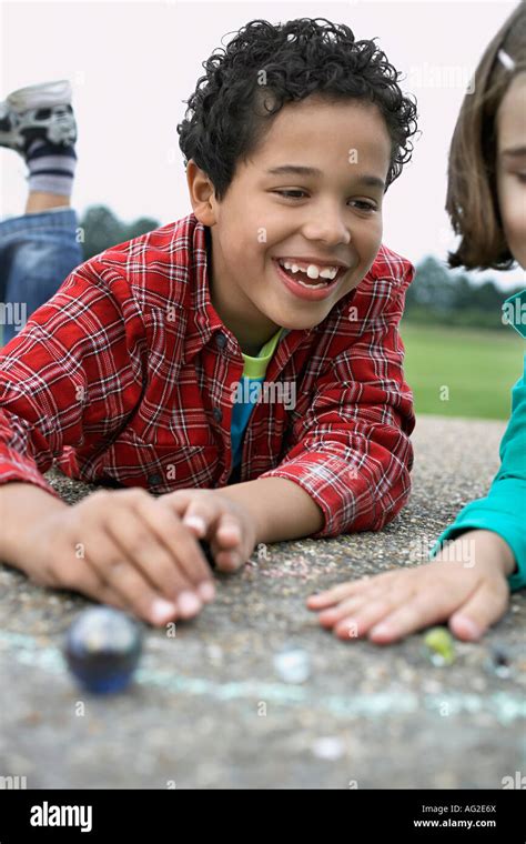 Boy Playing Marbles Stock Photos And Boy Playing Marbles Stock Images Alamy